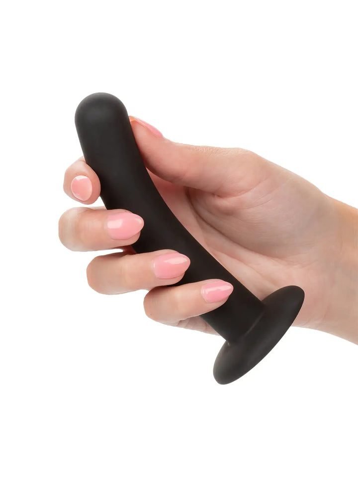 Boundless Silicone Curve Pegging Kit curved attachment shown in hand with smooth black silicone finish.