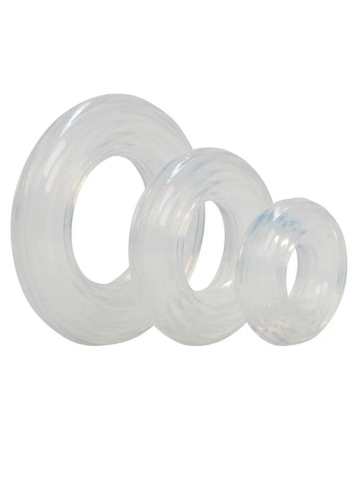 CalExotics Premium Silicone Ring Set featuring three clear silicone rings in different sizes.