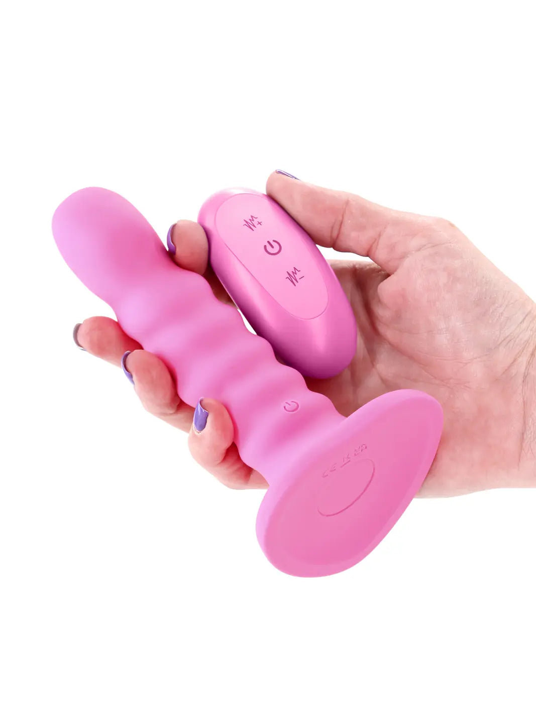 Colours Ribbed 5 inch Vibrating Pink shown in hand with textured design and remote control.