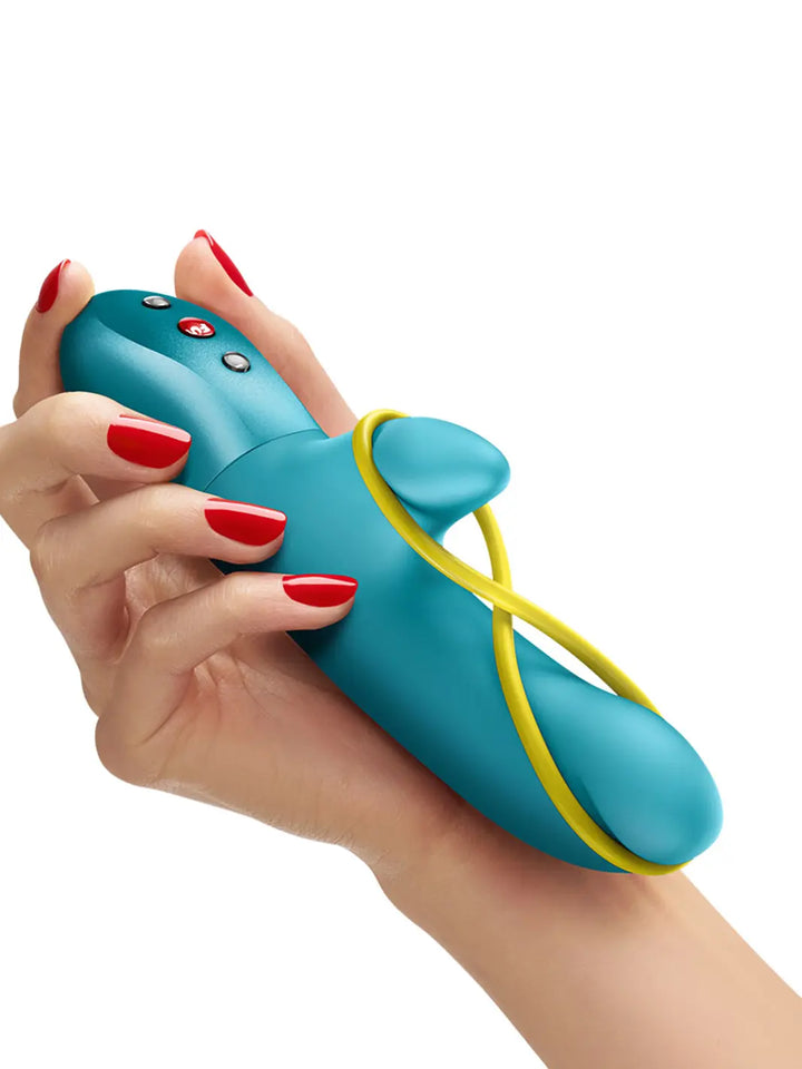 FUN FACTORY Amorino in aquamarine shown in hand with flexible loop, smooth silicone body and compact shape.