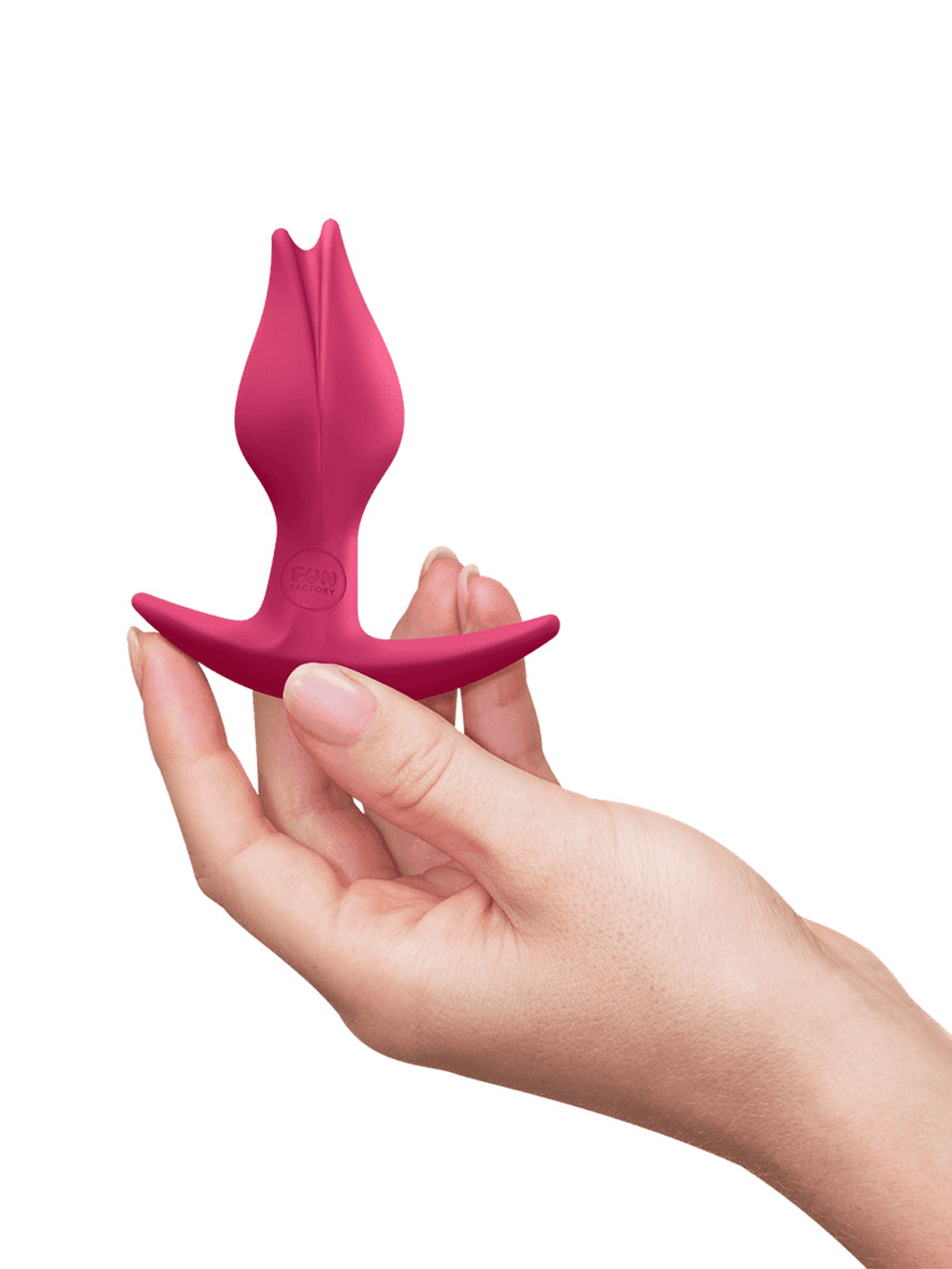 FUN FACTORY Bootie Fem in raspberry shown in hand with compact ergonomic silicone shape.