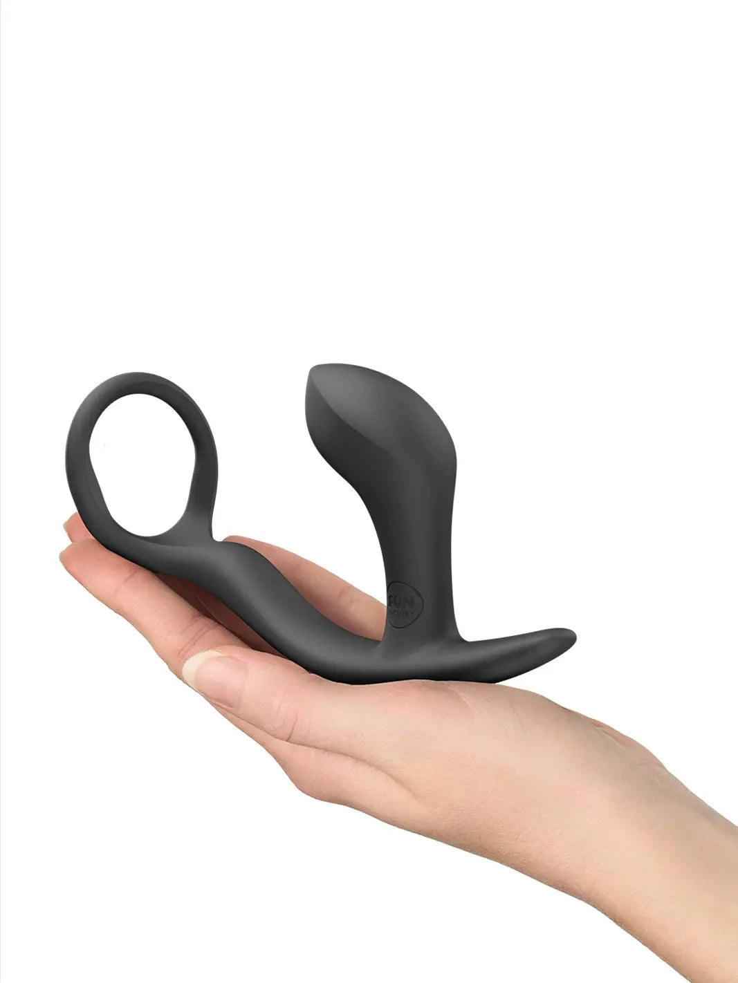 FUN FACTORY Bootie Ring in black shown in hand with curved silicone plug and ring handle.