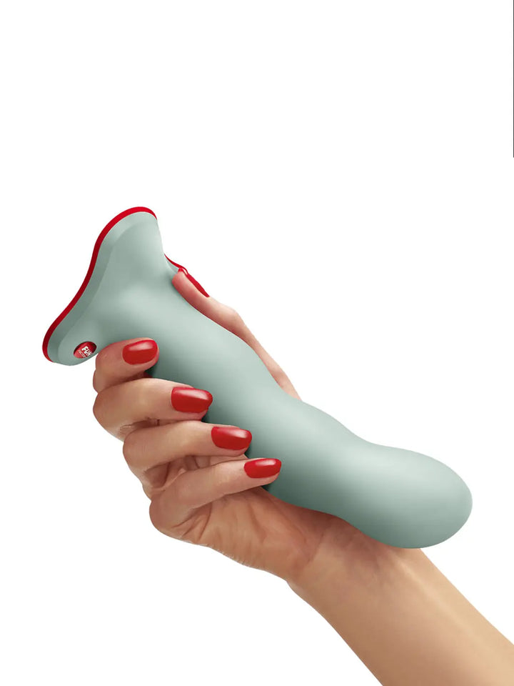 FUN FACTORY Bouncer vibro ball silicone dildo in green shown in hand for size reference