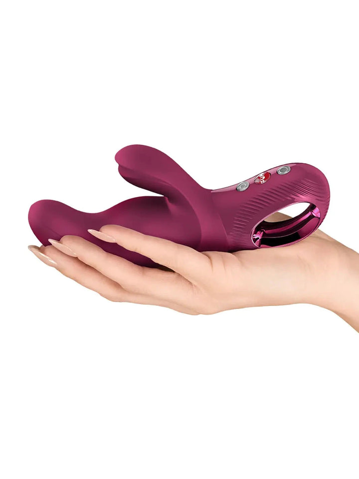 FUN FACTORY Miss Bi rabbit vibrator in wine red shown in hand for size reference - joujou.com.au