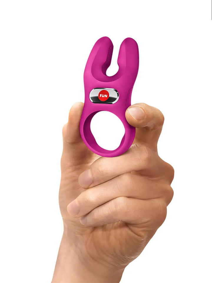 FUN FACTORY NOS Pro in magenta shown in hand for size reference and compact handling.