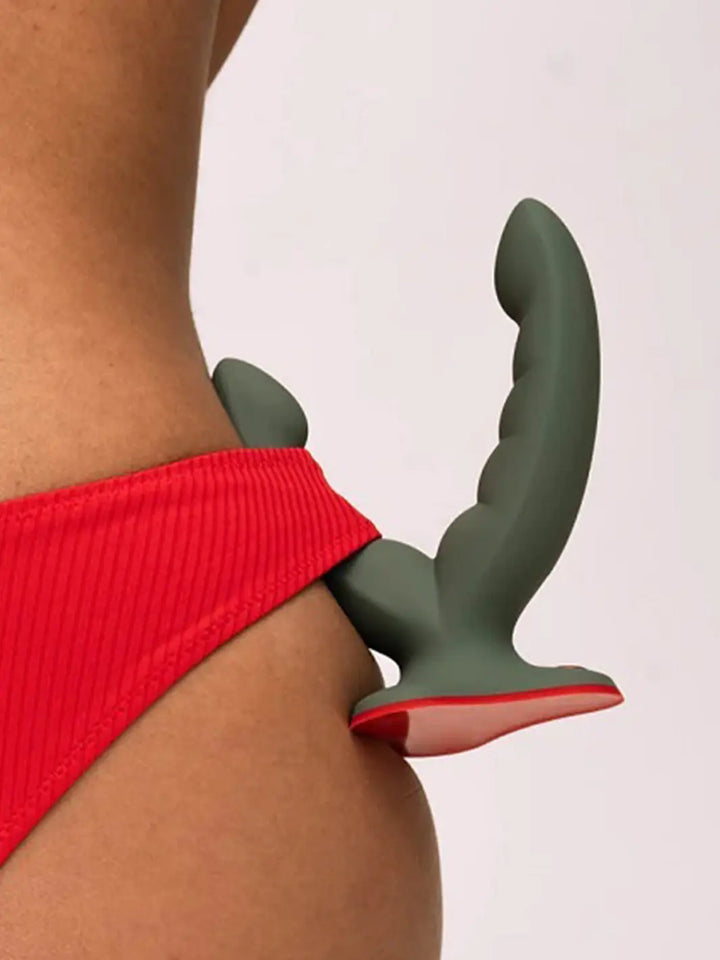 Close-up lifestyle detail of the FUN FACTORY Ryde dual stimulation grinding dildo in Wild Olive