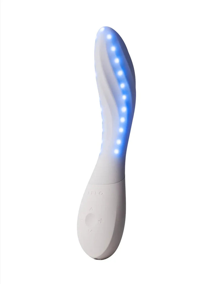 LELO Mona Spectra shown with blue illuminated detail along the curved silicone body.