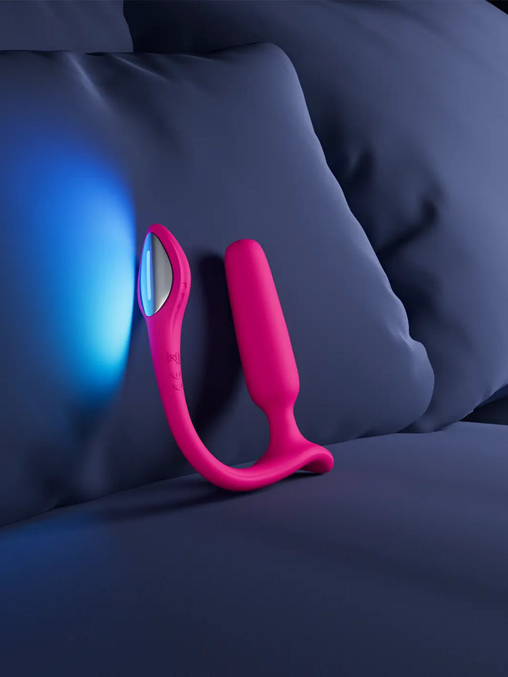 Lovense Lush Anal app-controlled vibrating plug shown in a modern bedroom lifestyle setting