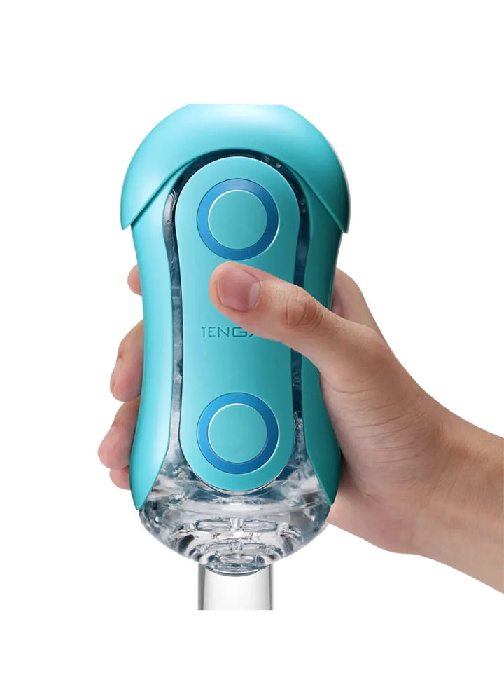 TENGA Flip Orb Ocean Blue shown in hand with compact pressure pads and clear base.