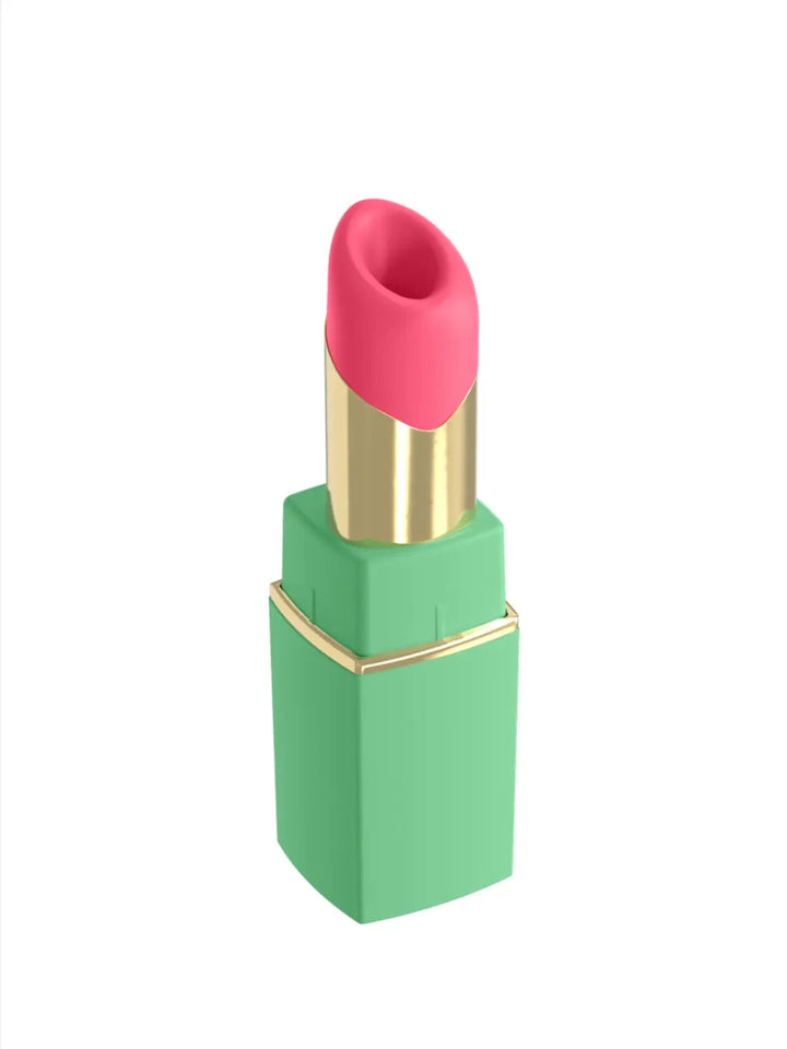Womanizer Beauty in green and pink angled view showing lipstick-inspired design with gold accent detail.