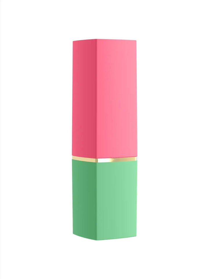 Womanizer Beauty in green and pink closed view showing discreet lipstick-style cover and compact design.