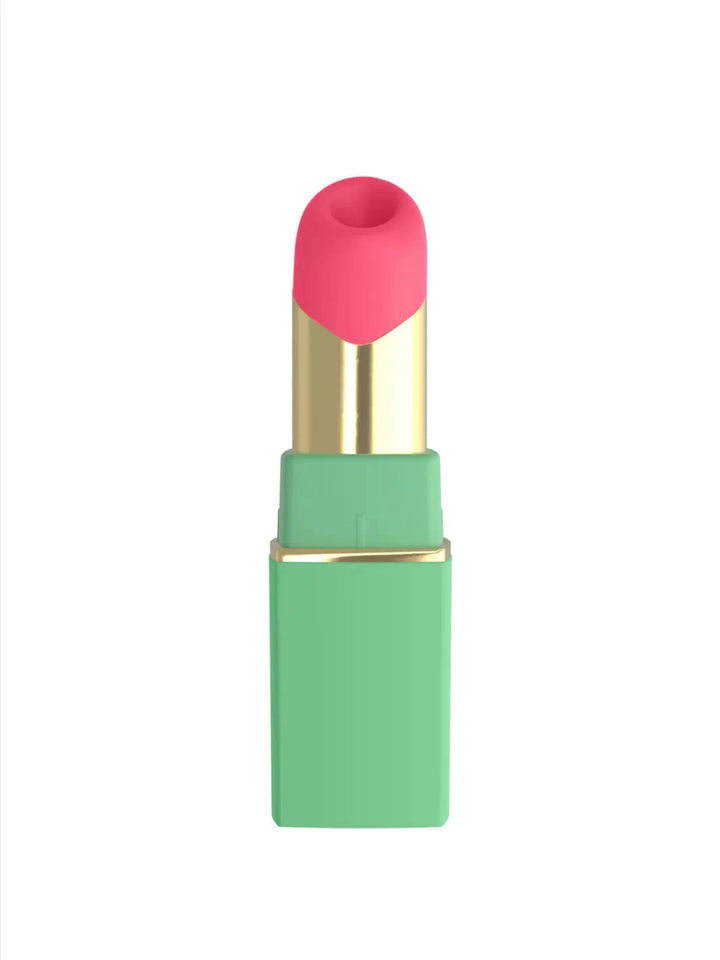 Womanizer Beauty in green and pink front view with lipstick-inspired shape and premium gold detailing.