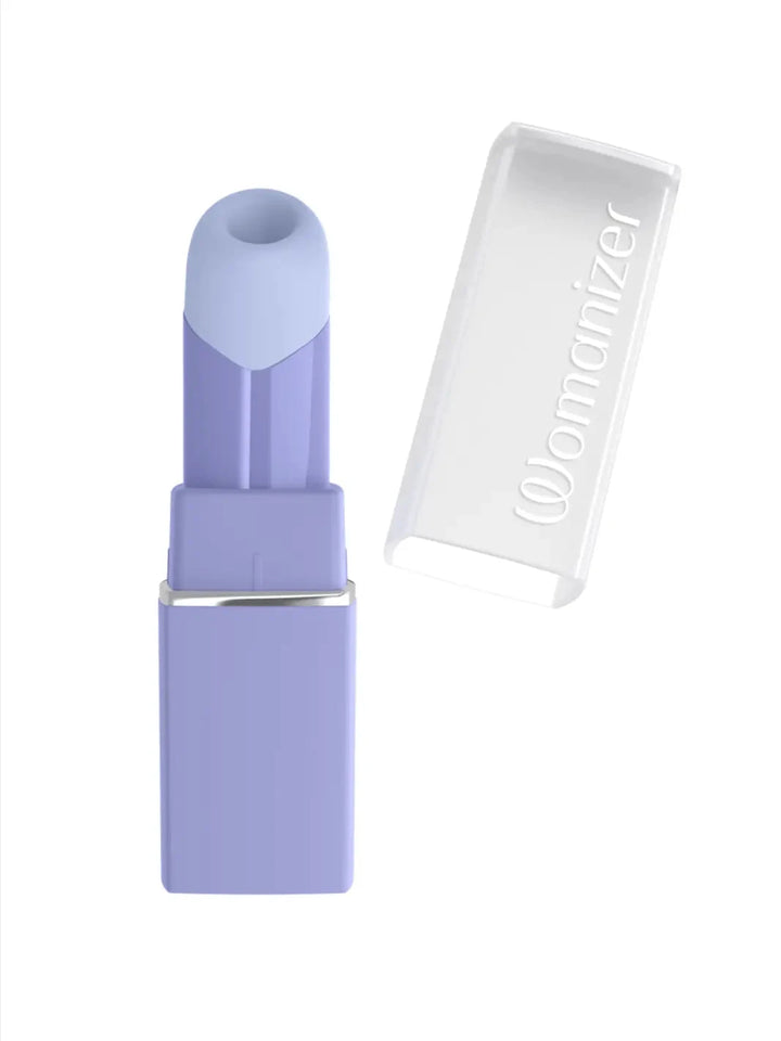 Womanizer Beauty in lilac open view showing lipstick-inspired cap and compact premium design.