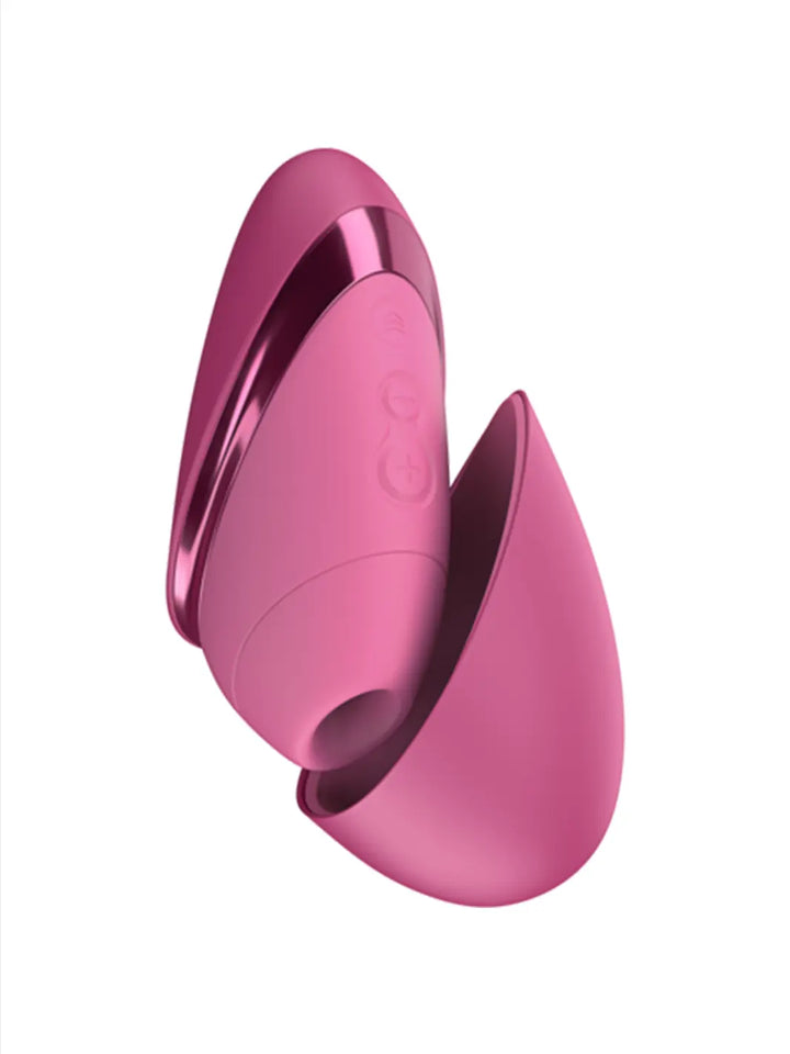 Womanizer Next Liberty in Pink open view showing the removable cover and compact curved shape.