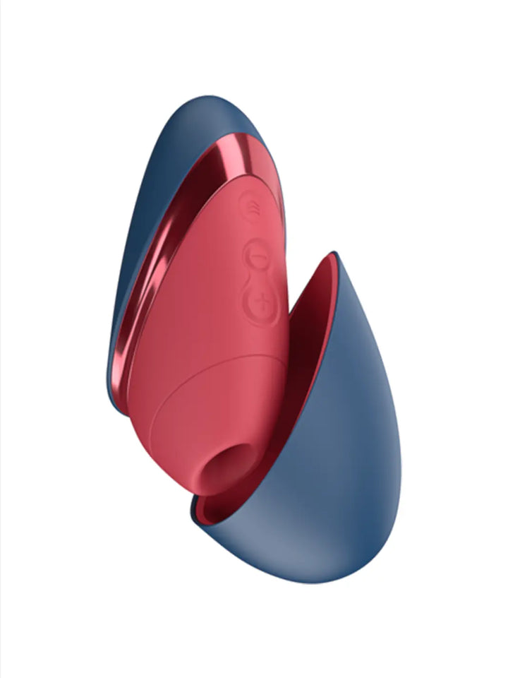 Womanizer Next Liberty in Red Blue main view showing compact curved design and metallic accent detail.