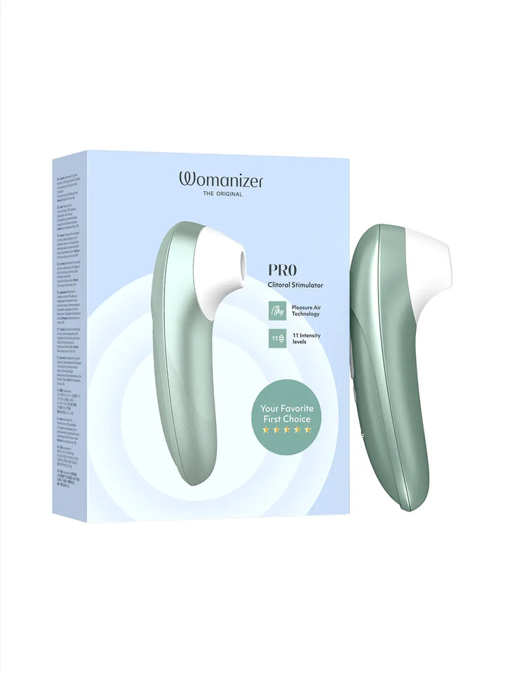 Womanizer Pro sage green displayed beside matching product packaging.