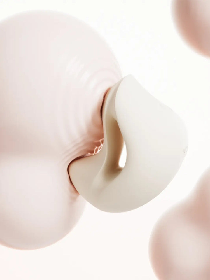 ZALO Mochi in ivory lifestyle image shown against the body with soft curved wearable design.